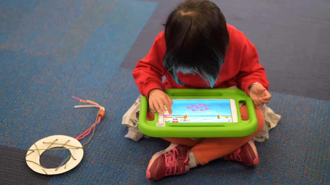 A child plays on an iPad (file image)