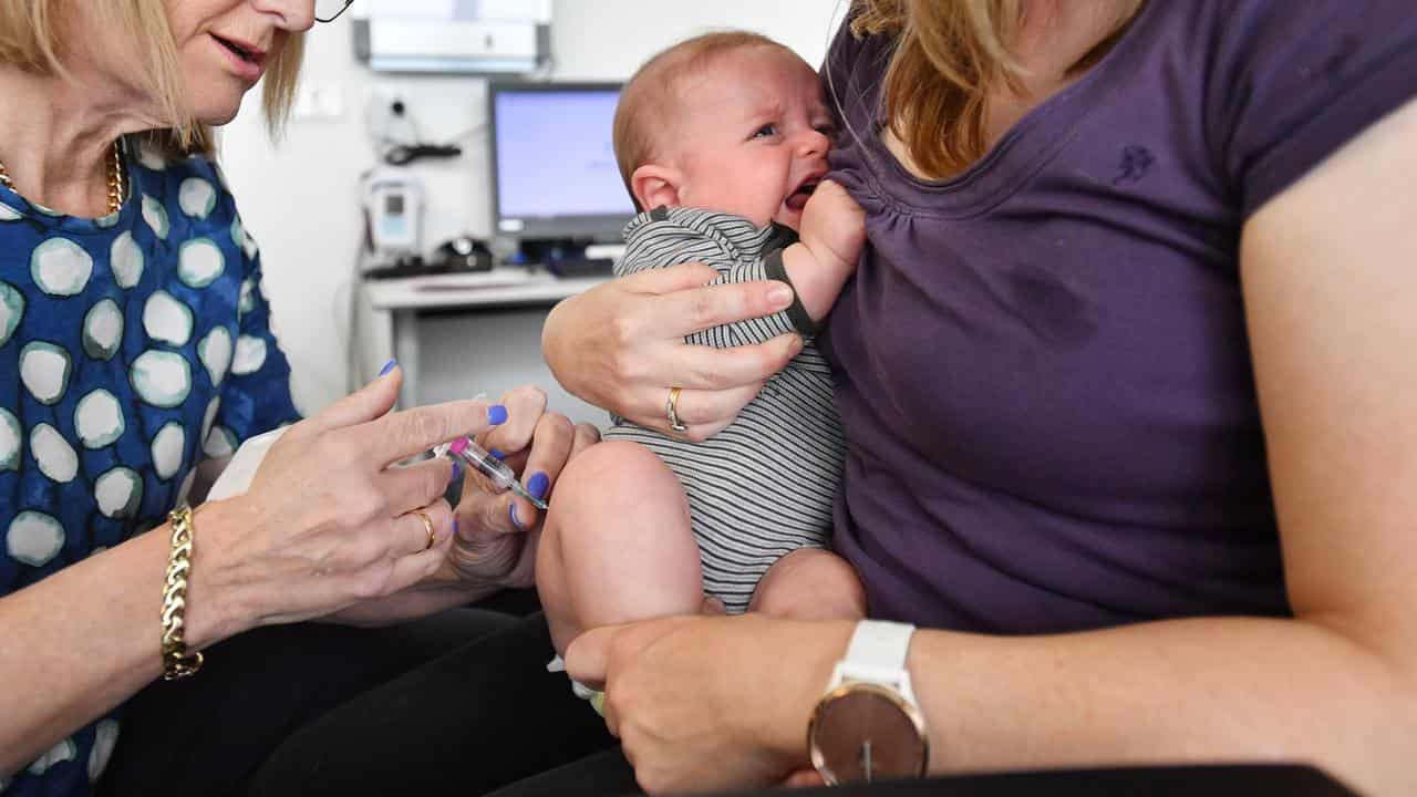 A baby receives a Meningococcal B vaccine (file image)