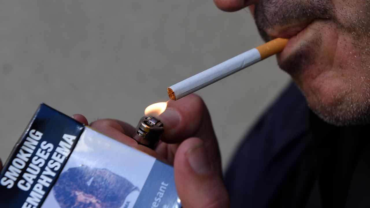 A man lighting a cigarette (file image)