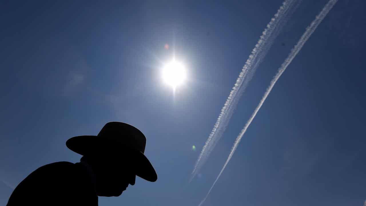 A plane's contrails above Canberra (file image)