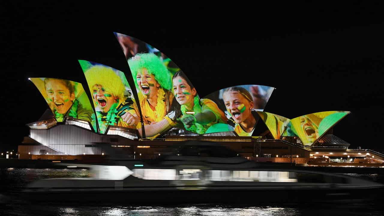 Sydney Opera House lit up with pictures for the Women's World Cup. 