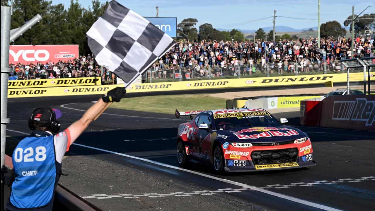 Shane van Gisbergen receives the chequered flag in the Bathurst 1000.