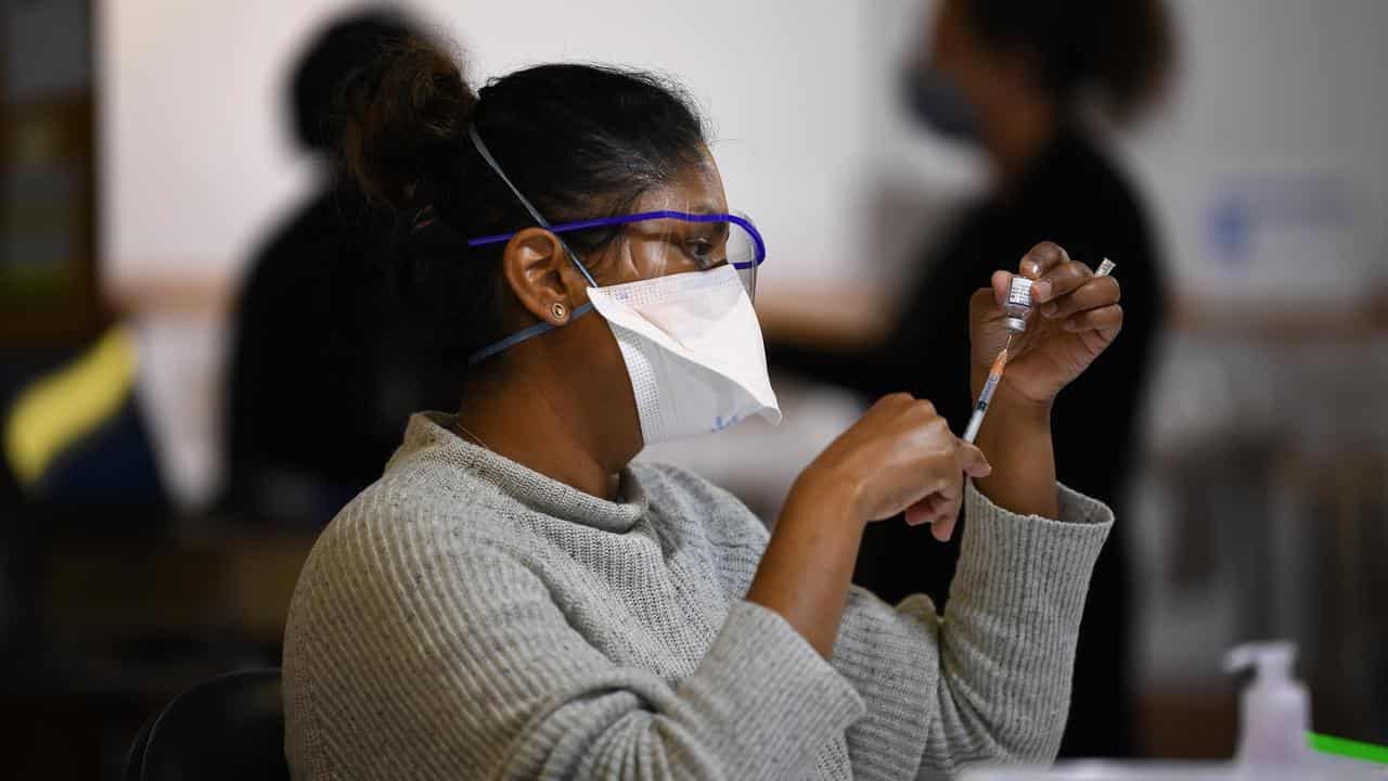 A healthcare worker prepping COVID-19 vaccinations (file image)