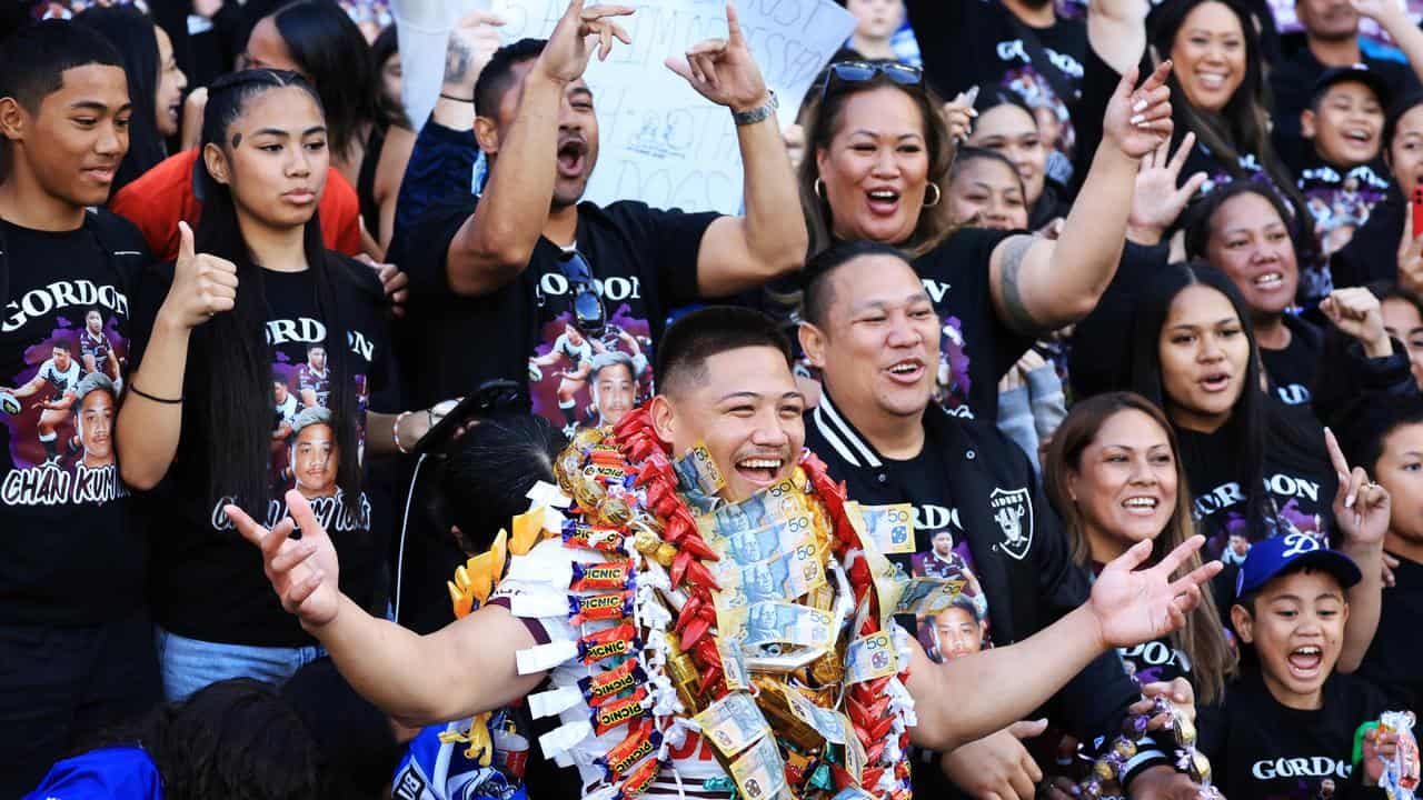 Gordon Chan Kum Tong is surrounded by family for his Manly debut.