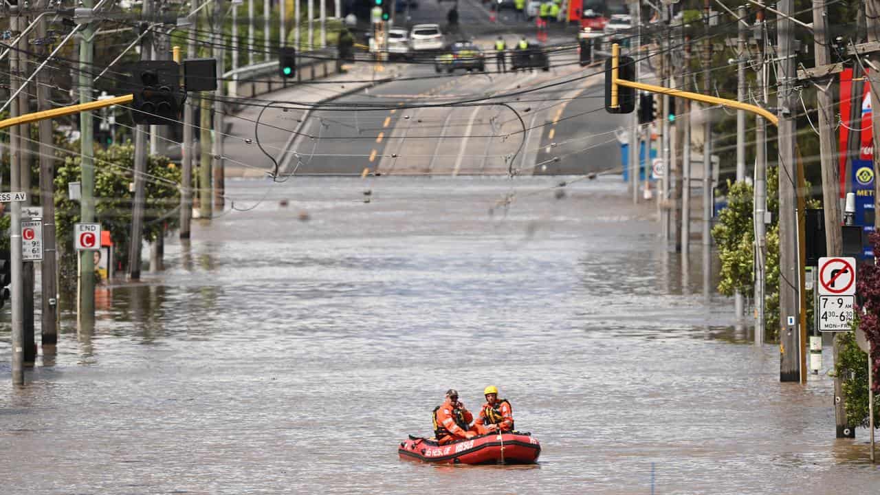 SES personnel searching floodwaters in Maribyrnong.