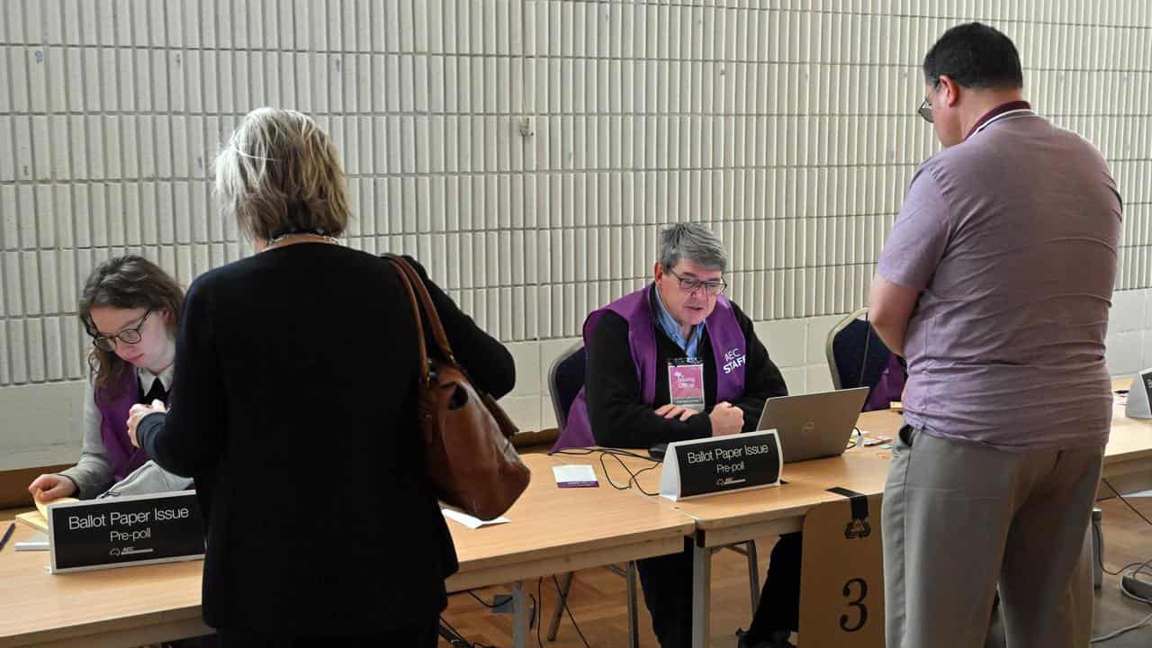 Voters and Australian Electoral Commission staff (file image)