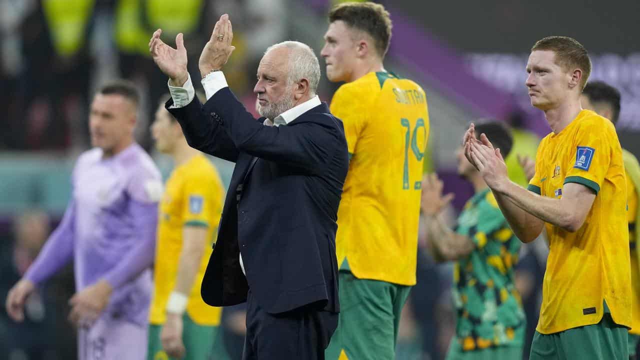 Australia coach Graham Arnold applauds supporters at the World Cup.