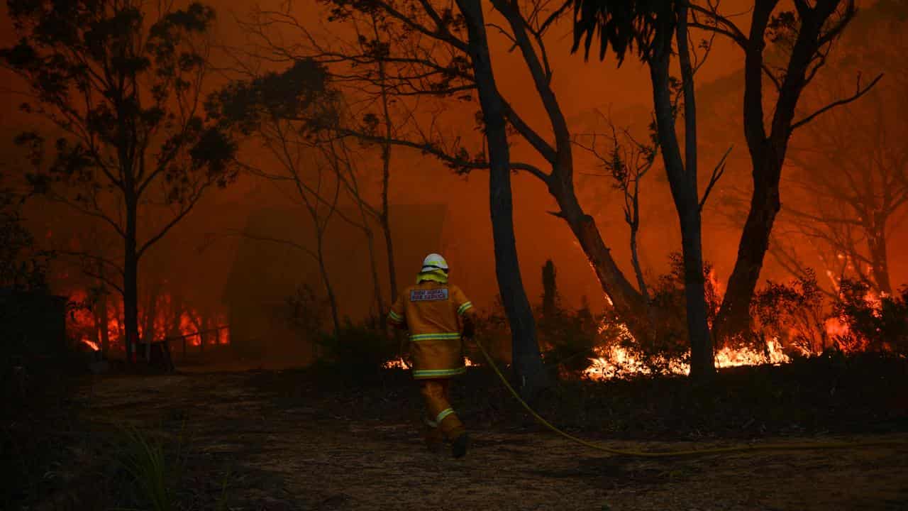 Firefighter battles blaze in NSW