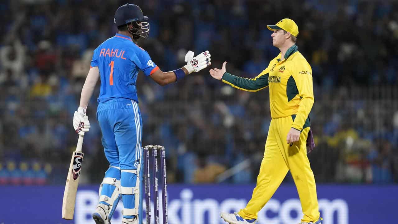 KL Rahul shakes hands with Steve Smith.