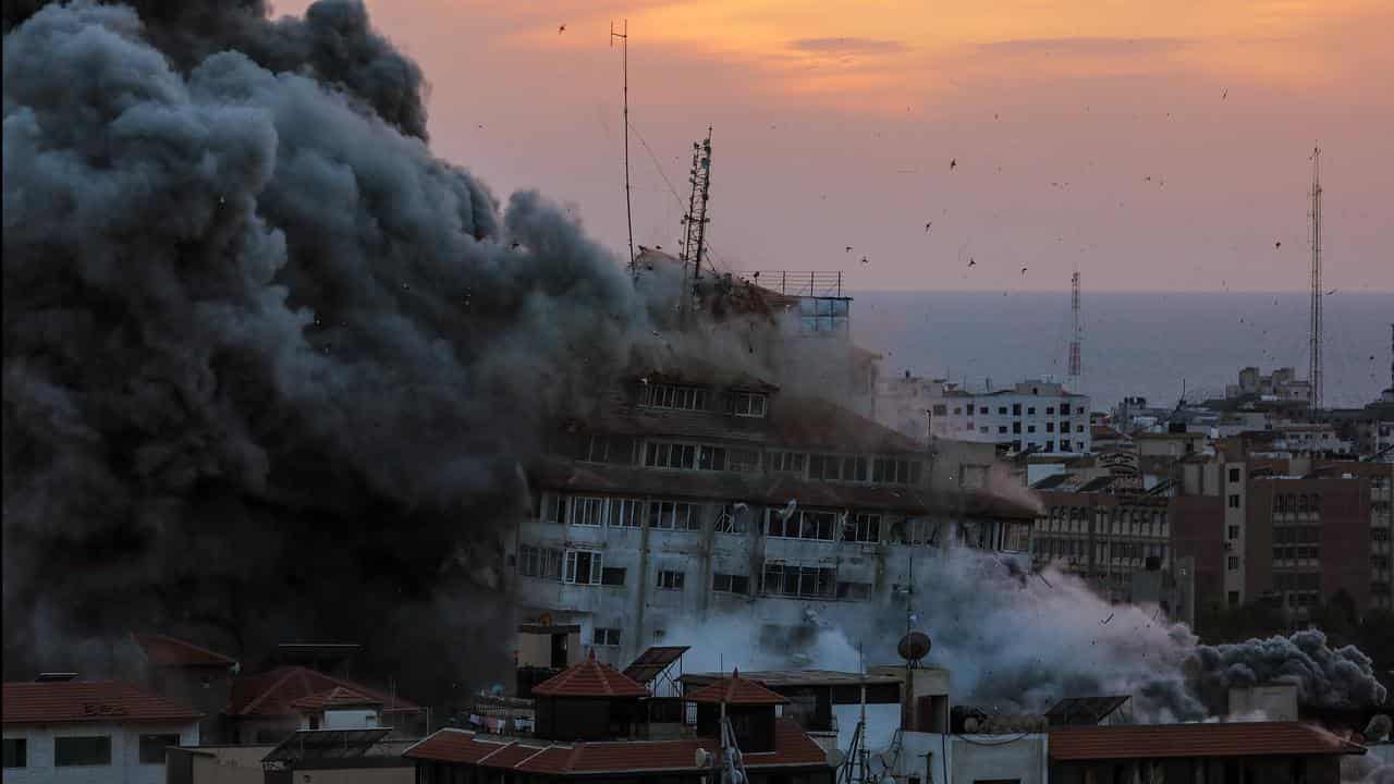 Palestine tower in Gaza City targeted by Israeli warplanes