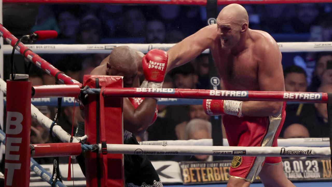 British boxer Tyson Fury (right) lands a punch on Derek Chisora.