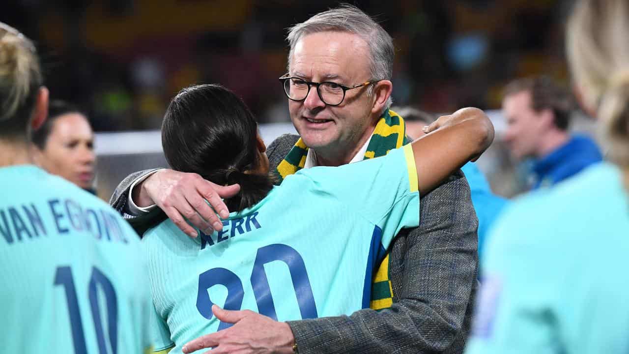 Anthony Albanese hugs Sam Kerr.