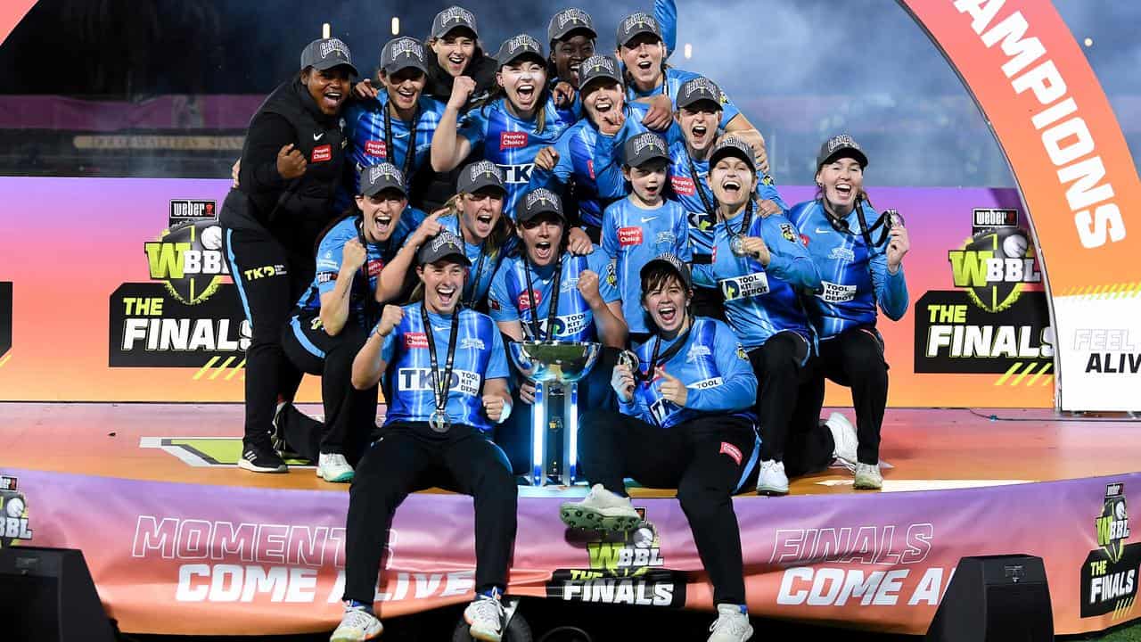 Adelaide Strikers celebrate after winning the 2022 WBBL. 