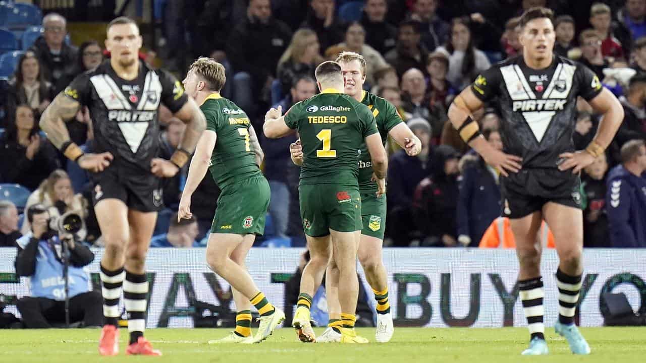 James Tedesco celebrates at fulltime.