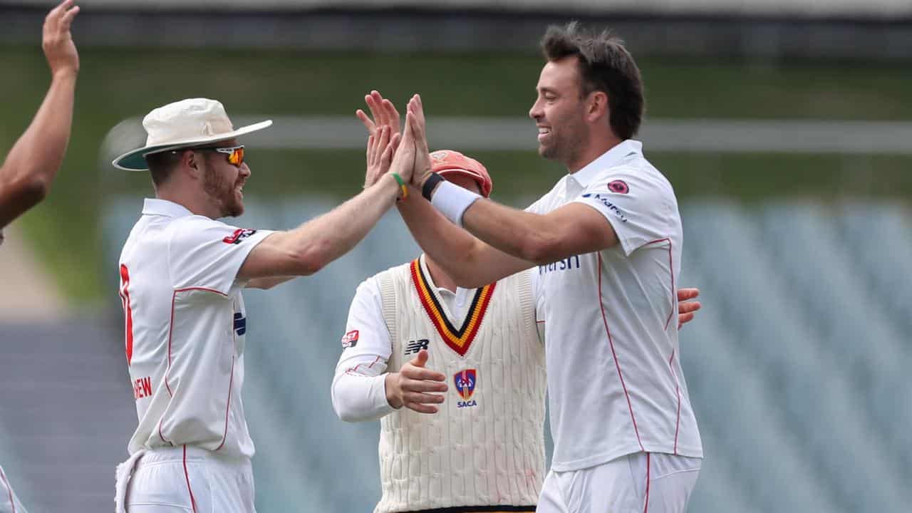 South Australia's Nathan McAndrew, left, congratulates Harry Conway