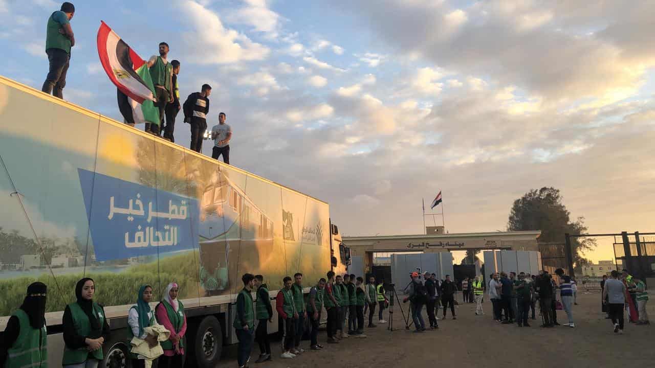 A truck carrying aid outside the Rafah border gate