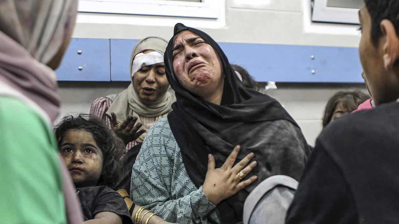 Wounded Palestinians following Israeli air strikes in Gaza City