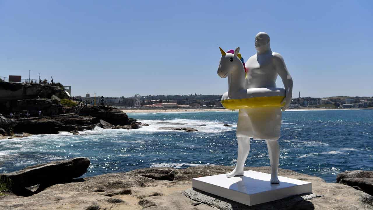 Sculpture of man with unicorn life ring