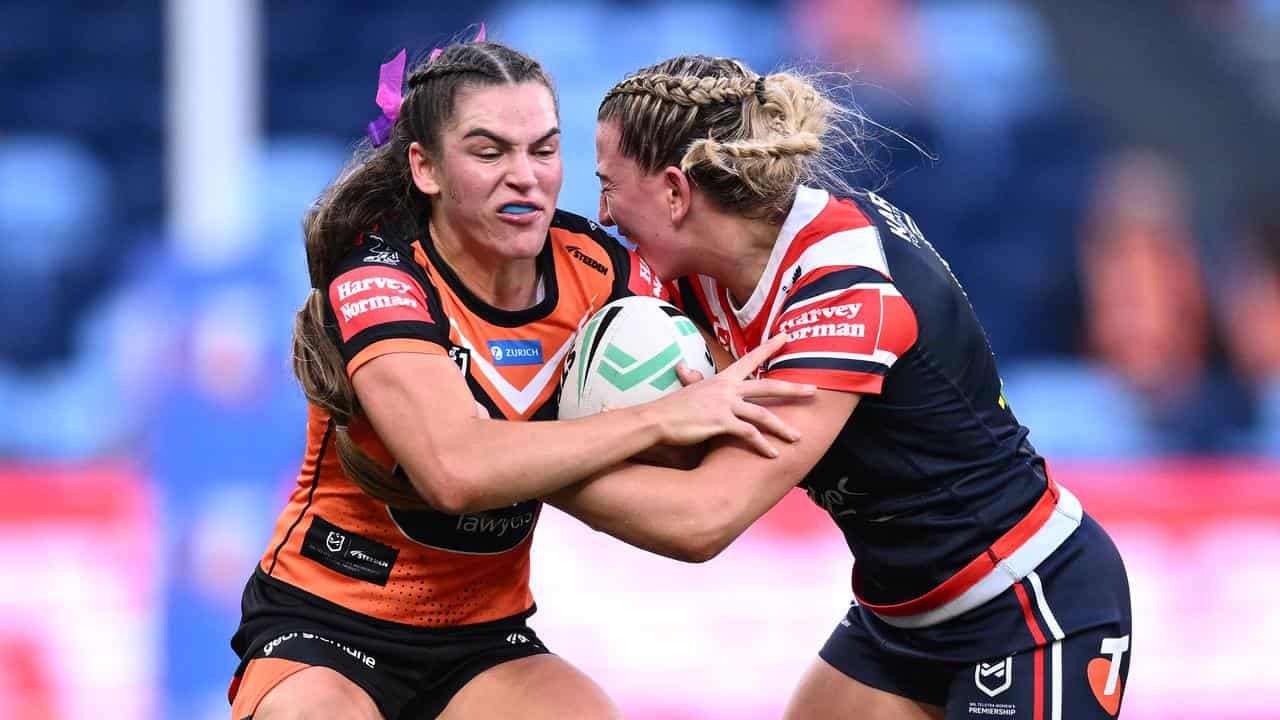 Wests Tigers' Jakiya Whitfeld (left).