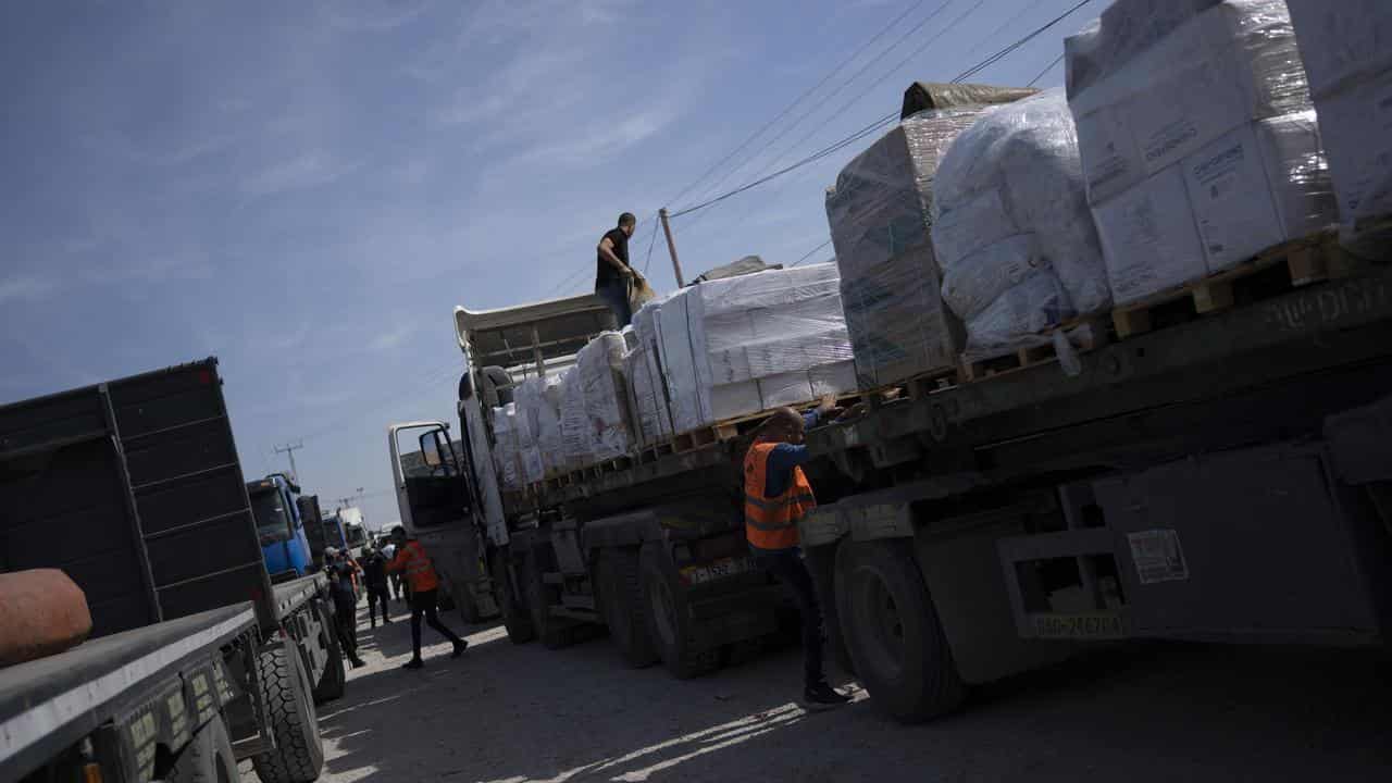 Trucks with humanitarian aid enter the Gaza Strip from Egypt.