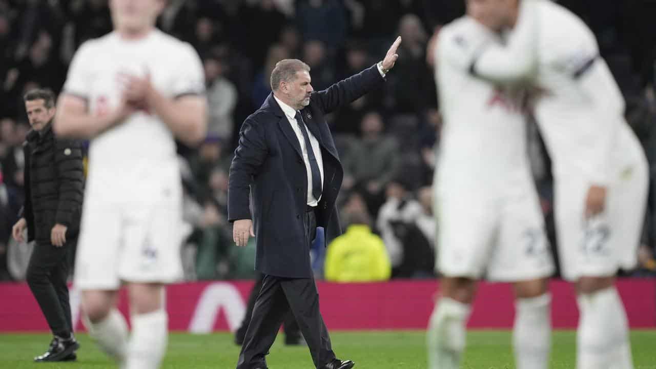 Tottenham manager Ange Postecoglou salutes the crowd. 