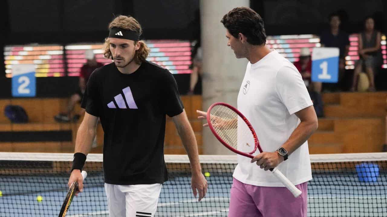 Stefanos Tsitsipas (l) with coach Mark Philippoussis at the 2023 AO.