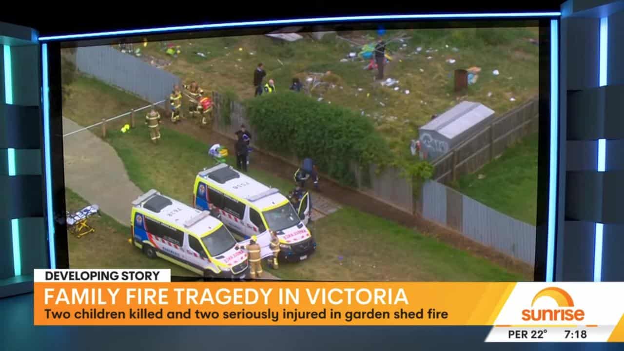 Ambulances at the scene of a shed fire in which two children died.