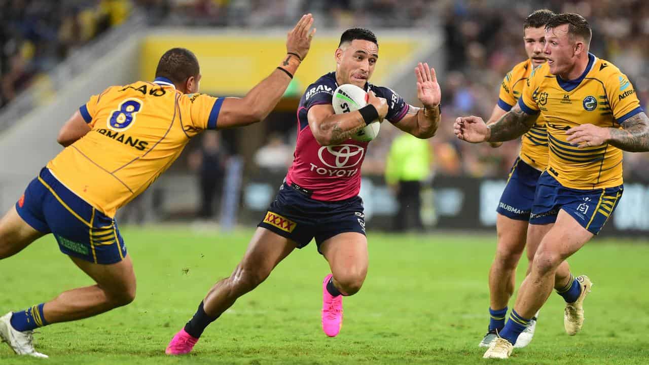 Cowboys star Valentine Holmes (centre)