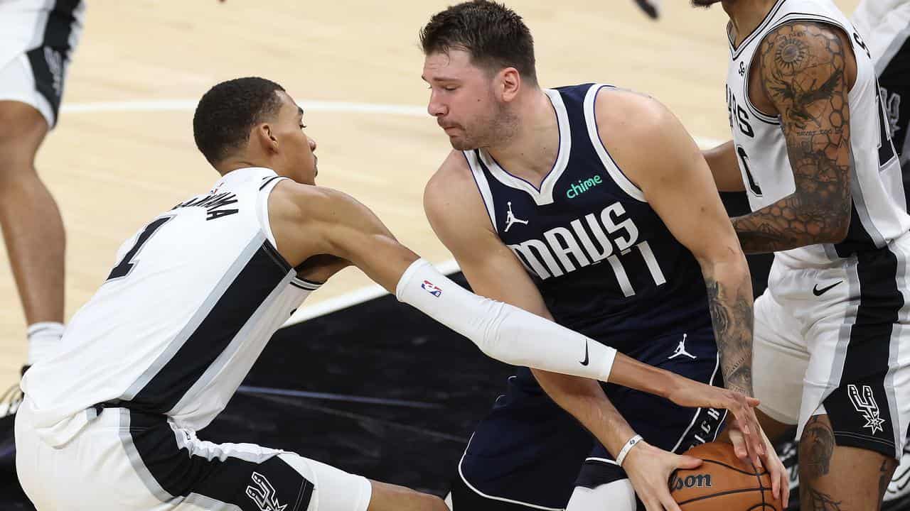 San Antonio Spurs' Victor Wembanyama (left) and Dallas's Luka Doncic