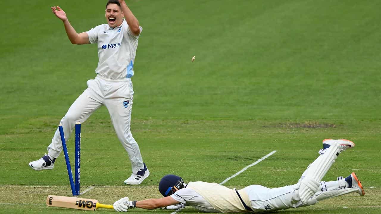 NSW's Ben Dwarshuis celebrates the run-out of Victorian Matthew Short.