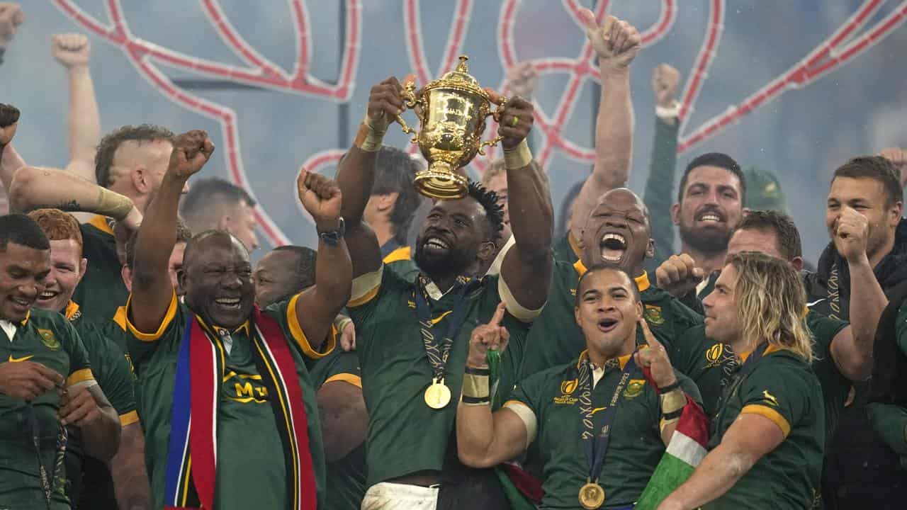 South Africa's Siya Kolisi holds the World Cup aloft.