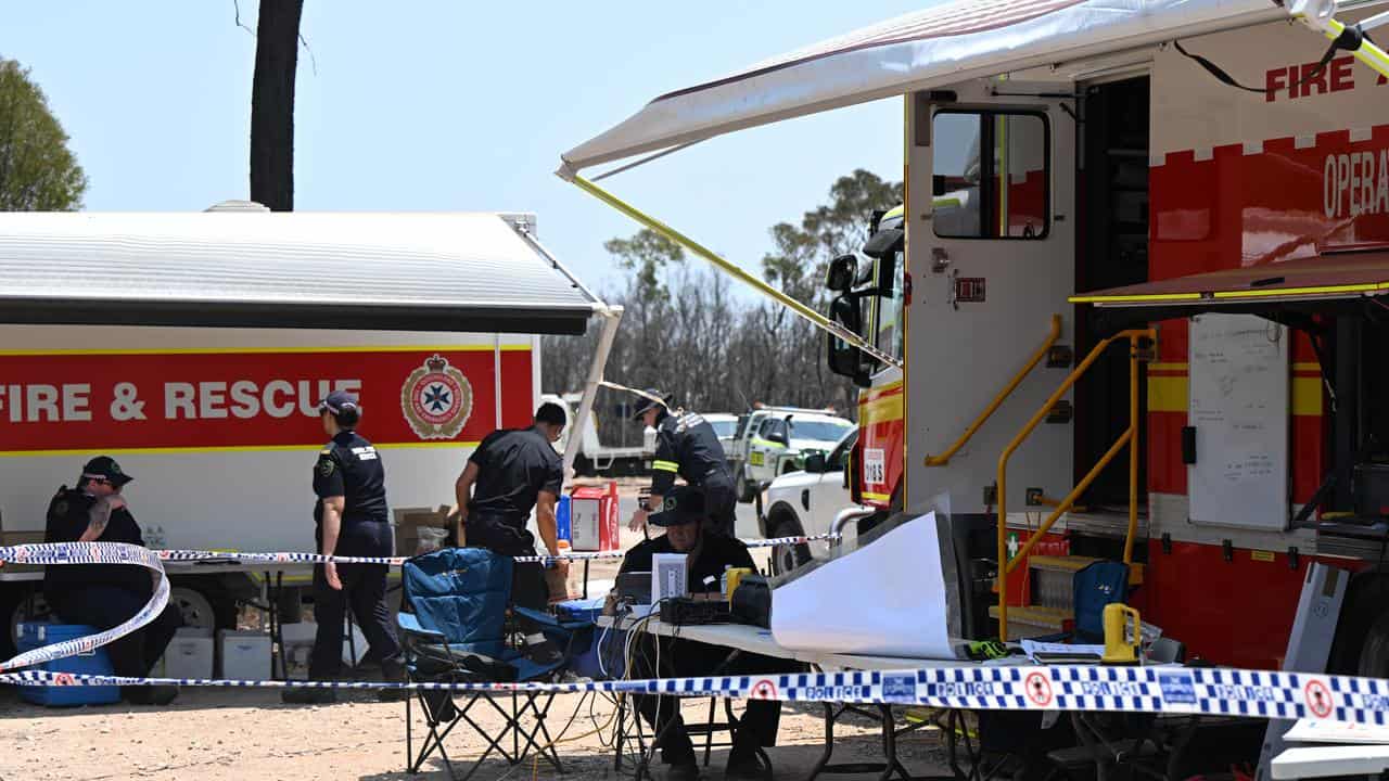 Firefighters are seen in the town of Tara, Queensland