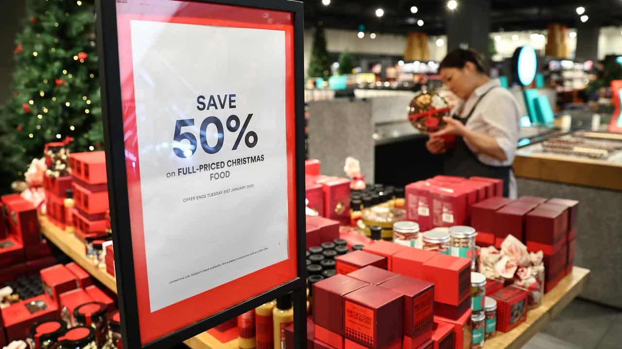 A shopper looks at Christmas decorations during Boxing Day Sales