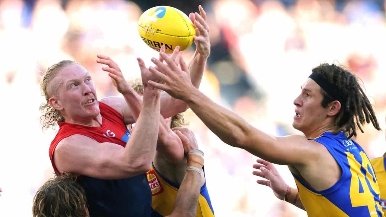 Clayton Oliver in AFL action for Melbourne against West Coast.