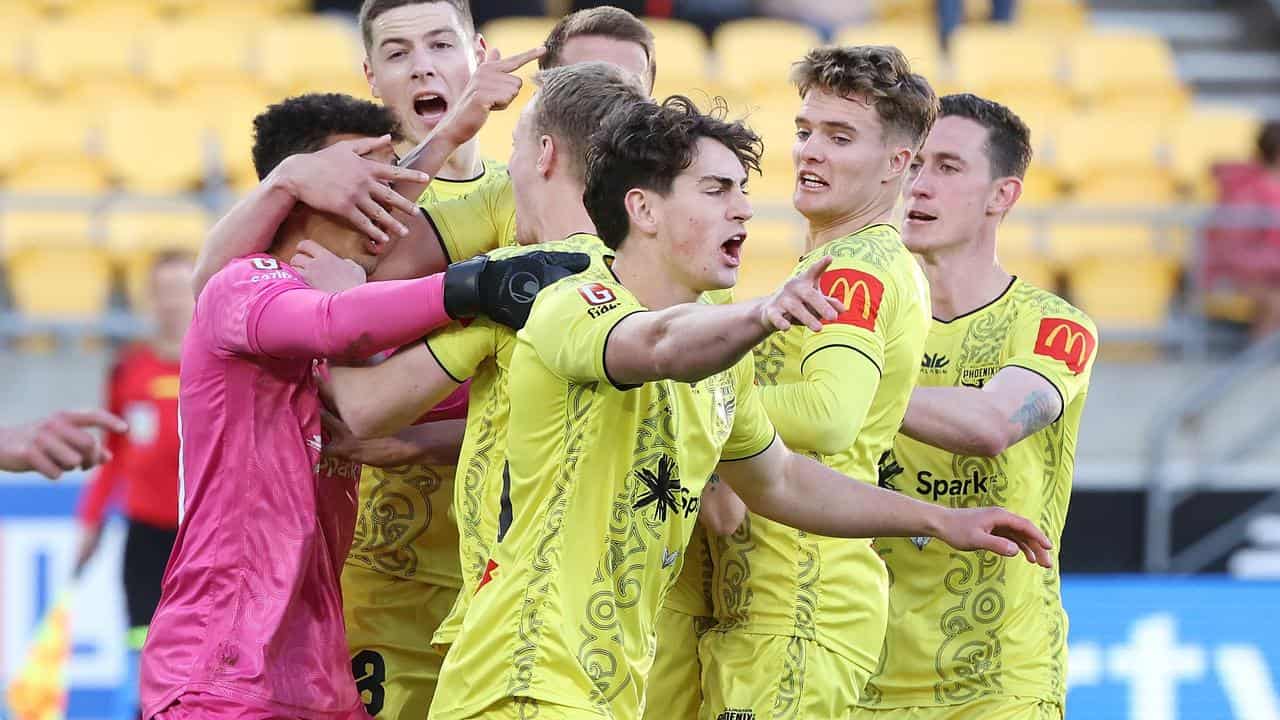 Wellington Phoenix players celebrating.