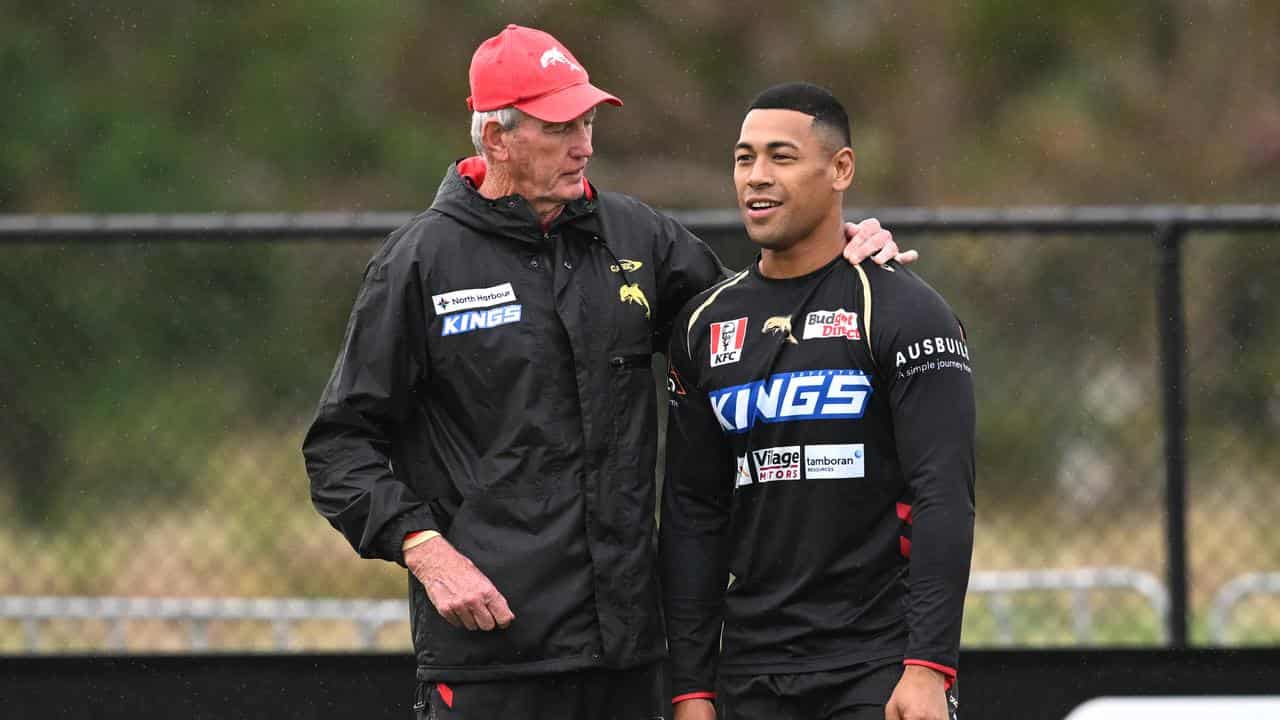 Dolphins coach Wayne Bennett (left) with Jamayne Isaako.