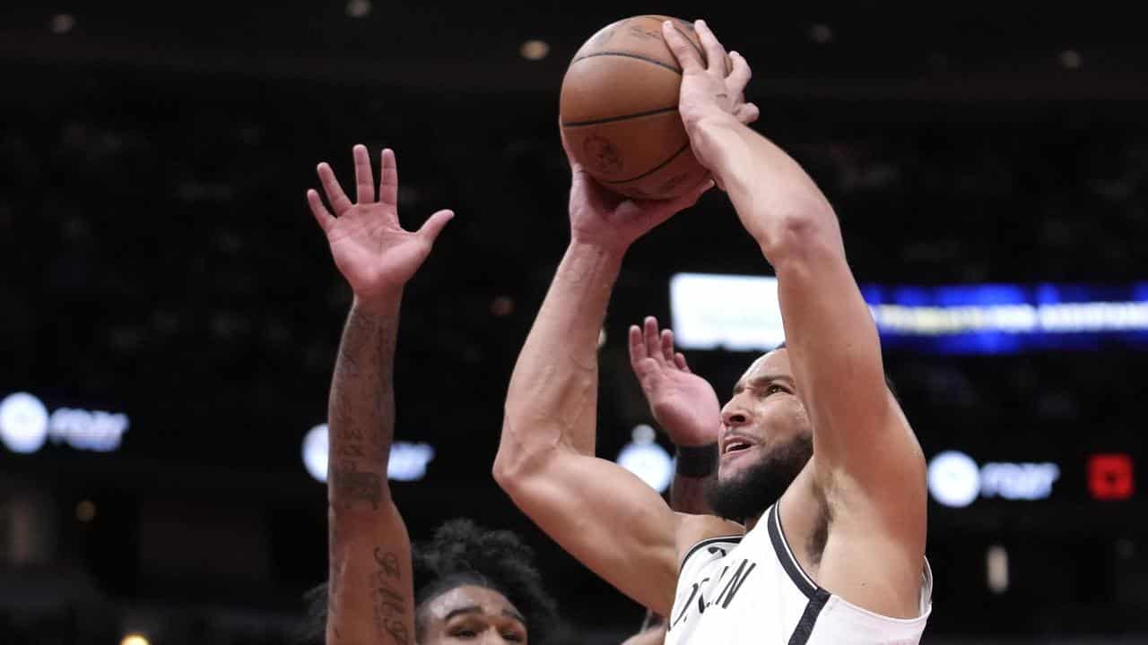 Brooklyn Nets' Ben Simmons (right) and  Chicago Bulls' Coby White