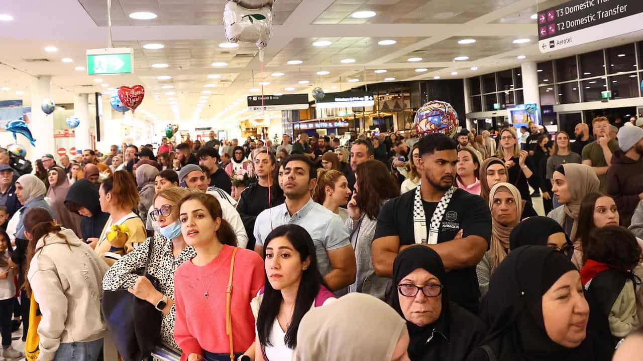 Families and friends wait at Sydney International Airport