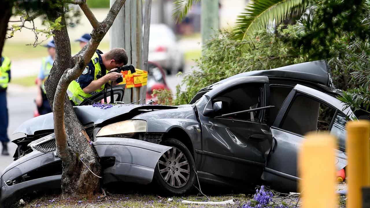 Emergency services at the scene of a car crash in Sydney