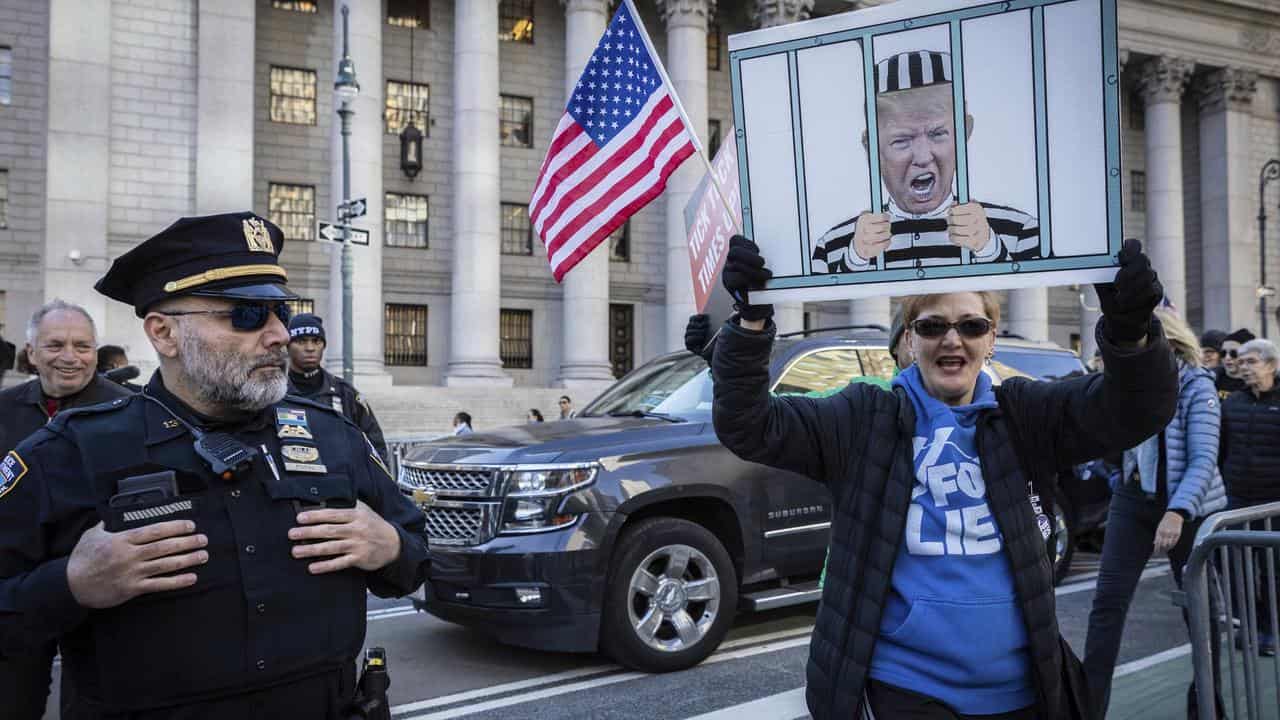 People protest against Donald Trump outside the New York Supreme Court