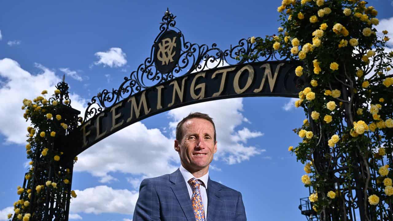 Jockey Damien Oliver at the Flemington gates.