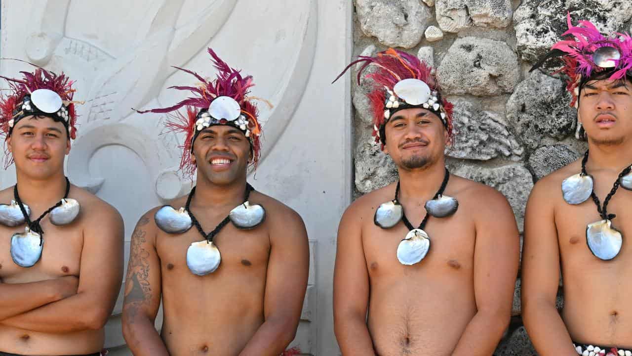 Locals wait to greet Anthony Albanese in the Cook Islands