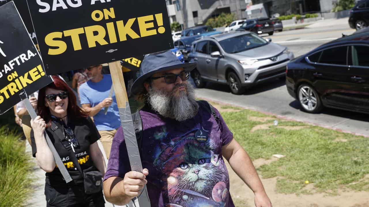 US actors Kate Flannery and Jack Black protest in LA