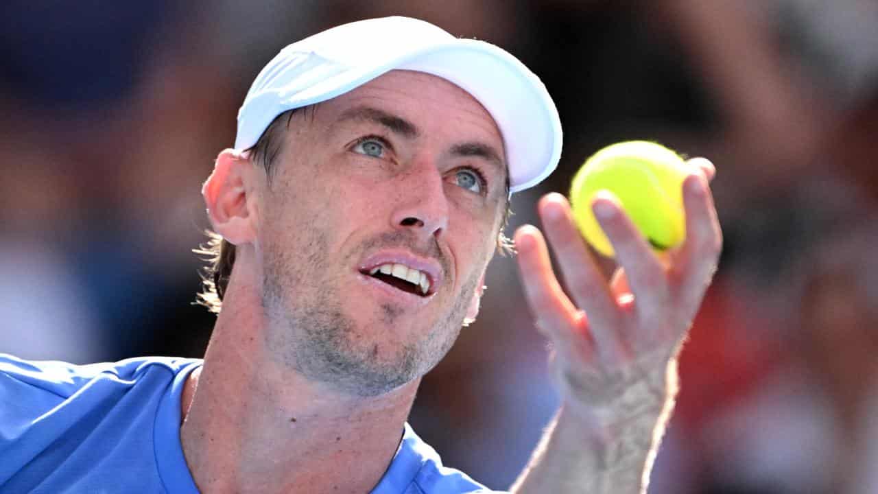 John Millman serves at the Australian Open.