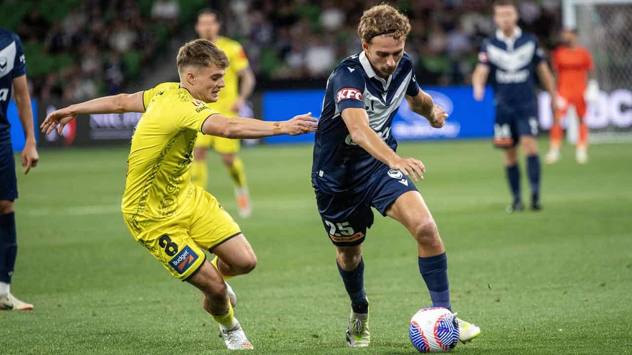 Melbourne Victory scorer Ryan Teague (right) on the ball v Wellington.