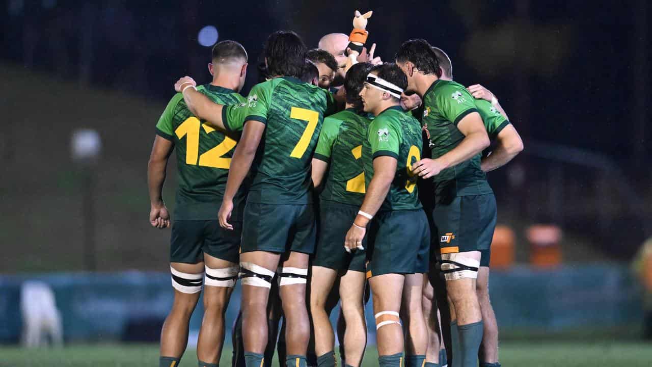 Australia's Oceania Rugby Sevens side in a huddle.