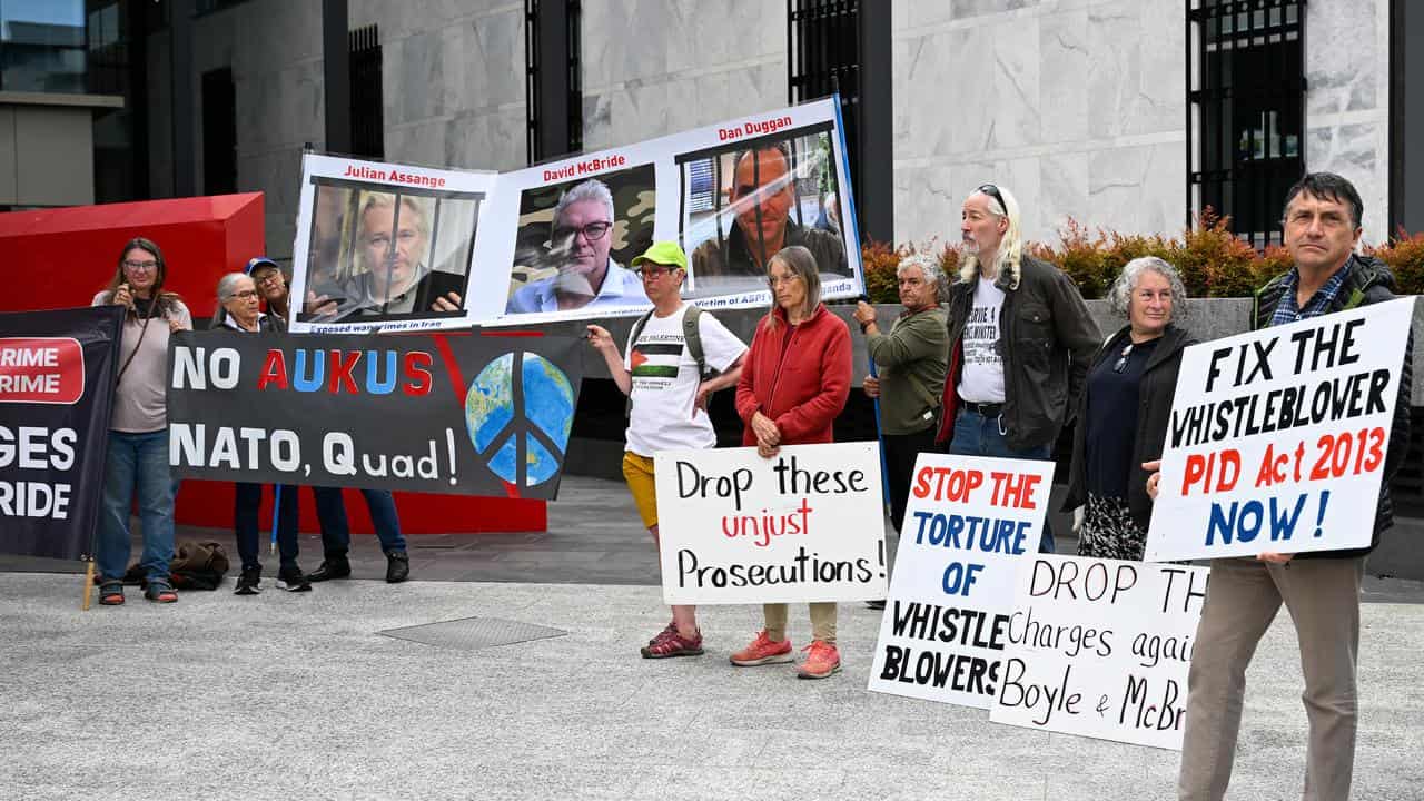 Supporters attend a protest before the trial of David McBride