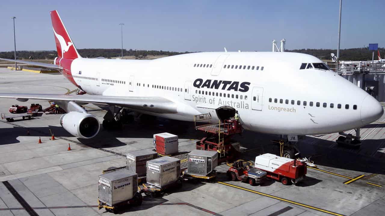 Qantas jumbo jet being loaded (file image)