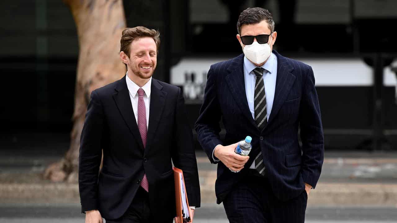 Karl Howard (right) arrives at Parramatta District Court