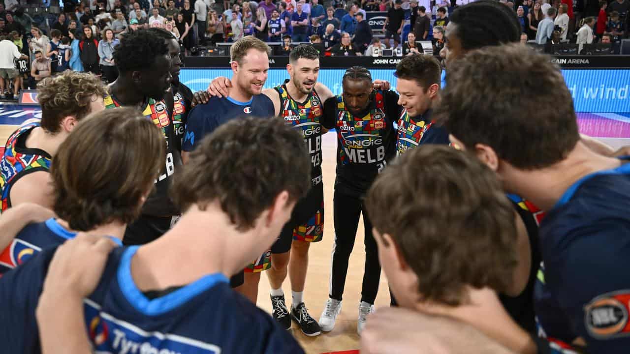 Melbourne United celebrate a win.